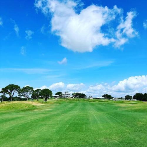 a view of a golf course with a green field at Gulf Breeze Tranquil Retreat 10 min to Beach RV boat jet ski parking in Gulf Breeze