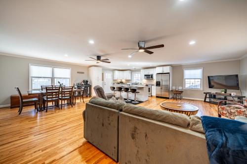 a living room with a couch and a dining room at Elegant Gem*Spacious 5BR*King beds*near Duke in Durham