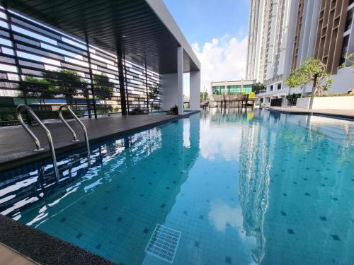 a swimming pool in the middle of a building at Sky Trees Bukit Indah netflix and wifi in Johor Bahru