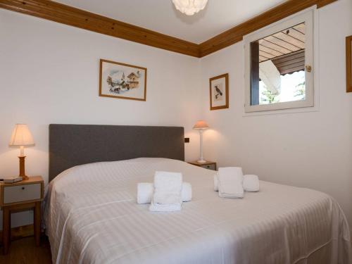 Postel nebo postele na pokoji v ubytování Courchevel 1850 - Charmant appartement 4 pers, proche des pistes, balcon, garage, WiFi - FR-1-631-217