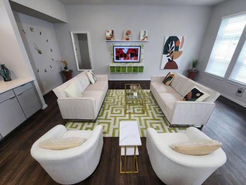 a living room with two couches and a rug at Galleria Premium 3 Story Home Sleeps 8 in Houston