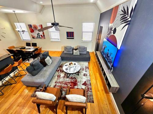a living room with a couch and a table at Galleria Comfort 3BR King Bed Private Jacuzzi and Garage in Houston