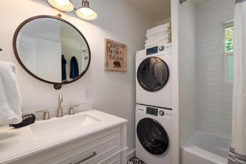 a bathroom with a sink and a washing machine at The Brook Ave Bungalow in Kings Beach