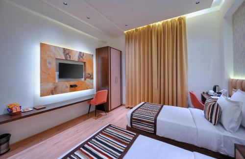 Un ou plusieurs lits dans un hébergement de l'établissement Hotel Sun Ring