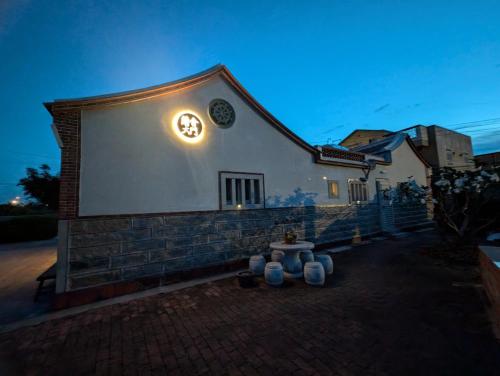 a building with a clock on the side of it at Lanshe Gate in Chung-lan