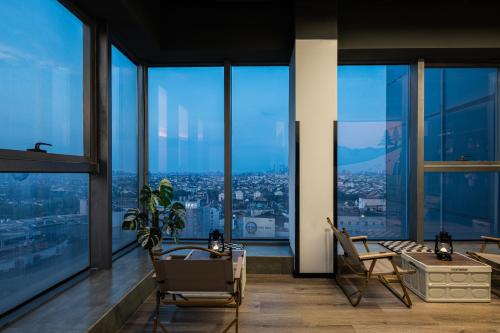 a living room with a view of a city at Suzhou Desti Youth Park Hostel in Suzhou
