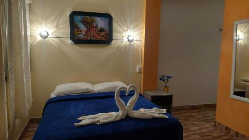 En eller flere senge i et værelse på ElOlympo