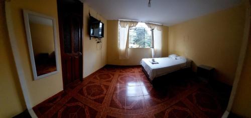 En eller flere senge i et værelse på ElOlympo