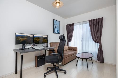 a living room with a desk and a chair at FDS AIM in Osaka