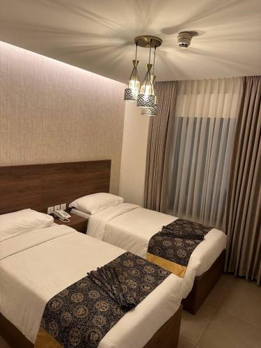 Giường trong phòng chung tại Dara apartment hotel