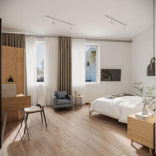 a bedroom with a bed and a desk and a chair at Habyt Kada at Maxwell in Singapore