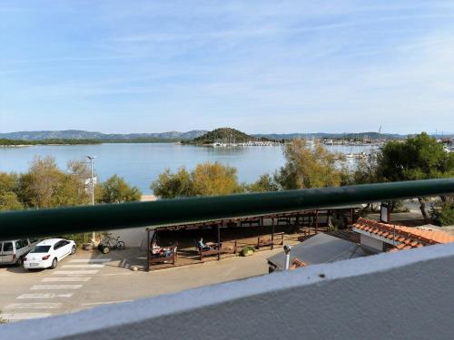 a view of a lake from a balcony at Apartments Helena - One bedroom apartment with Balcony and Sea View - A1 in Murter