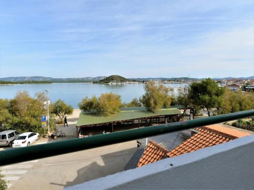 a view of a lake from a balcony at Apartments Helena - One bedroom apartment with Balcony and Sea View - A1 in Murter