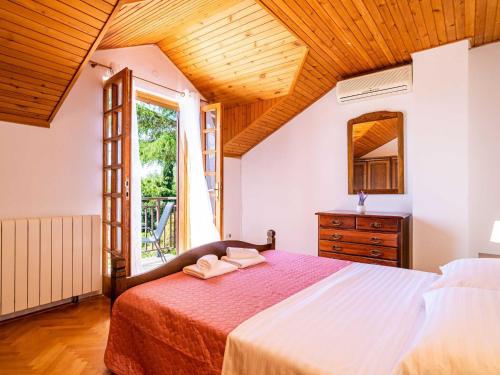 Ένα ή περισσότερα κρεβάτια σε δωμάτιο στο Villa Niko - Three bedroom villa with swimming pool