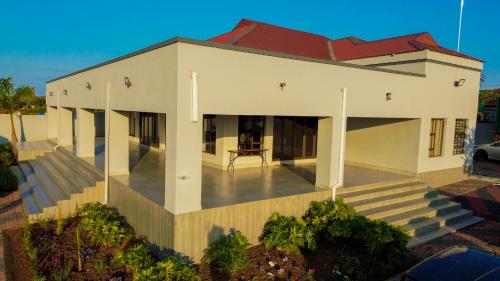 an aerial view of a house with a porch at Mercy Boutique Hotel in Thohoyandou