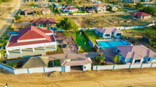 an overhead view of a house with a swimming pool at Mercy Boutique Hotel in Thohoyandou