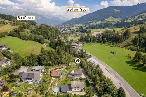 an aerial view of a village in a valley with a road at Sonnrain GmbH Apartment Sonnberg 77 Leogang in Leogang