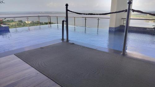 a view of a pool of water on a building at Good Stay Pool view Premium Studio Apartment 206 in Dabolim