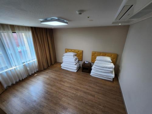 Postel nebo postele na pokoji v ubytování Hotel Haema