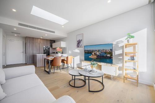 a living room with a couch and a table at Waterloo 1Br town close to Train Shopping in Sydney