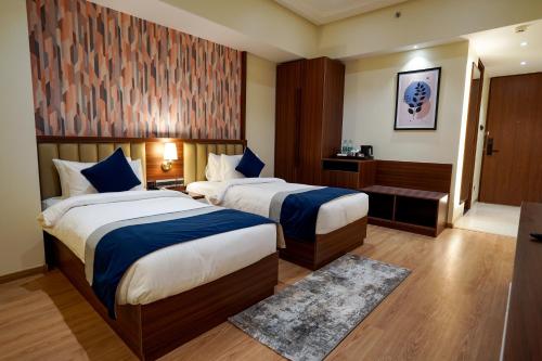 Cama ou camas em um quarto em M2 Square by Monday Premium