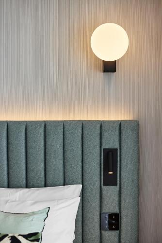 Katil atau katil-katil dalam bilik di H4 Hotel Wyndham Paris Pleyel Resort