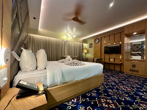 Postel nebo postele na pokoji v ubytování Hotel Imperial Inn