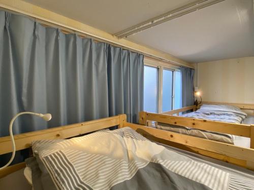 Katil atau katil-katil dalam bilik di Fukuoka Tabiji Hostel & Guesthouse