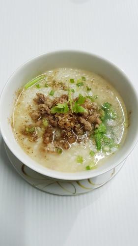 a bowl of soup with meat and vegetables in it at Kasithorn Apartment's & Hotel in Phetchabun