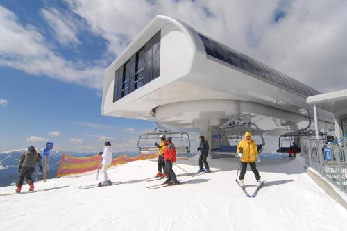 a group of people on a ski lift at Wellness Landhaus Parth in Ossiach