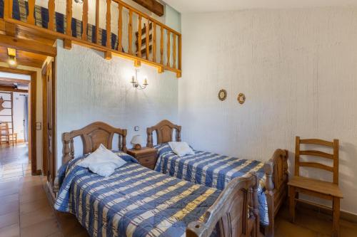 Postel nebo postele na pokoji v ubytování La Cárcava