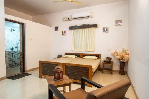 Ένα ή περισσότερα κρεβάτια σε δωμάτιο στο 5 bhk villa with swimming pool