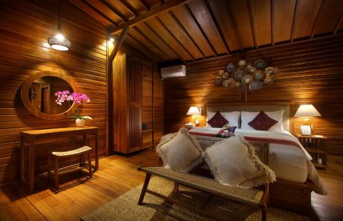 Кровать или кровати в номере Patal Kikian Villa