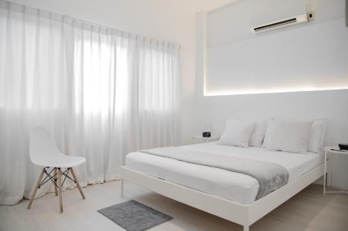 Postel nebo postele na pokoji v ubytování HAO Hotel Phuket
