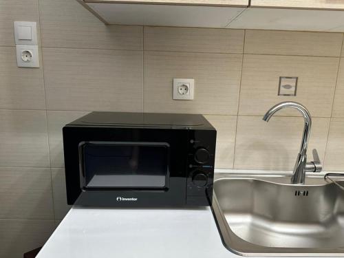 ครัวหรือมุมครัวของ Quiet simple brand new luxury apartment by the sea