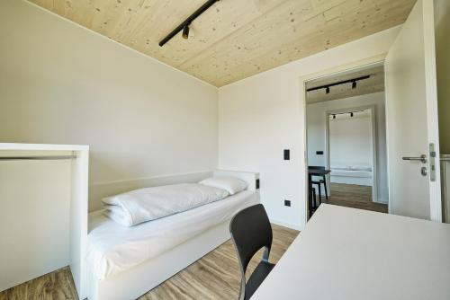 Ένα ή περισσότερα κρεβάτια σε δωμάτιο στο Timber One Boardinghouse Dorfen