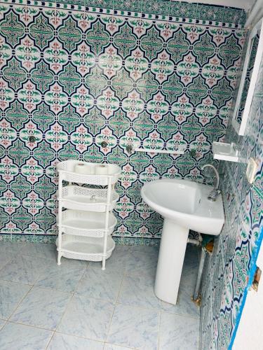 a bathroom with a sink and a toilet and a sink at Charmante villa de 4 chambres au deux oueds hammamet in Nabeul