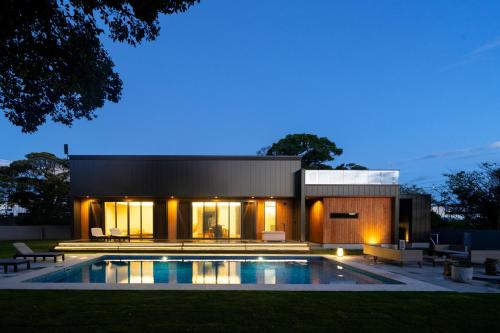 a house with a swimming pool in front of it at EKVOLI MARINA VILLA,Isumi Garden in Chōjamachi