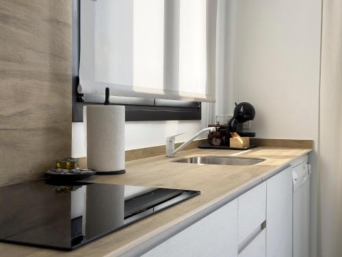 Kuchyň nebo kuchyňský kout v ubytování Apartamentos Clotilde