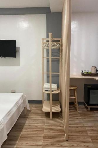 Ένα ή περισσότερα κρεβάτια σε δωμάτιο στο Woza Inn Boracay