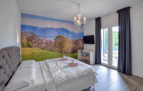 a bedroom with a bed with a painting on the wall at Dolce Bosco in Montebelluna