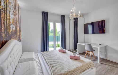 a bedroom with a bed and a desk and a window at Dolce Bosco in Montebelluna