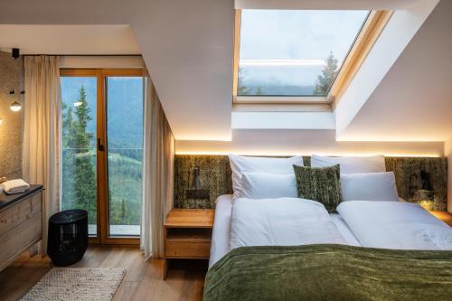 Postel nebo postele na pokoji v ubytování Luxus AlmChalets Schladming-Dachstein