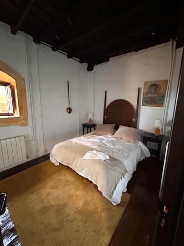 Ένα ή περισσότερα κρεβάτια σε δωμάτιο στο Casona con encanto, siglo XVIII
