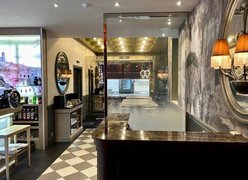 a dressing room with a counter and a mirror at Hôtel Alchimy in Albi