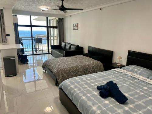 Postel nebo postele na pokoji v ubytování Beach View Stay
