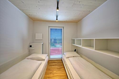Ένα ή περισσότερα κρεβάτια σε δωμάτιο στο Timber One Boardinghouse Dorfen