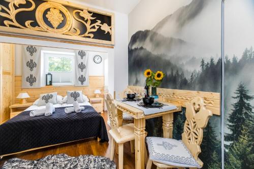 Posteľ alebo postele v izbe v ubytovaní Pałac Tatrzański Apartamenty