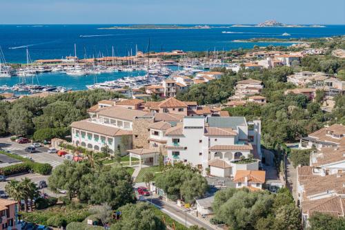 an aerial view of a small town with a marina at Hotel Sestante in Porto Rotondo