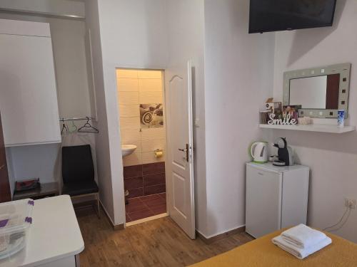 a room with a bathroom with a sink and a mirror at Guest house Renata 2 in Zadar